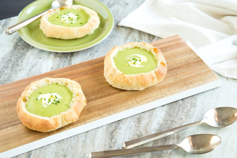Healthy vegetarian dinner: Spring pea soup in a bread bowl