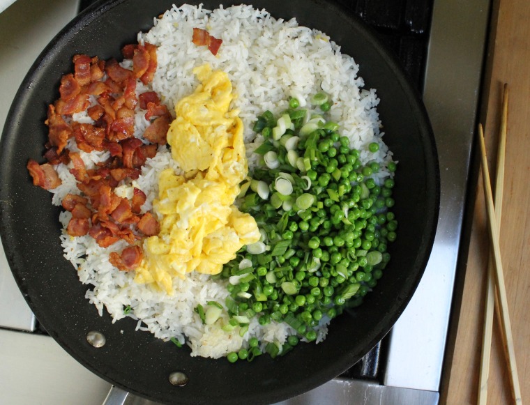 15-Minute Bacon and Egg Fried Rice: Add the bacon, scrambled eggs and peas