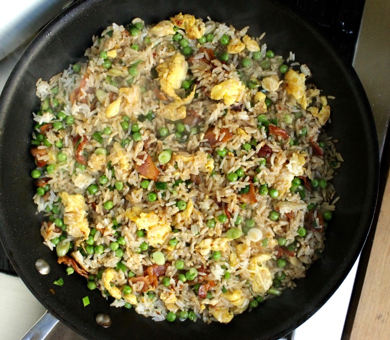 15-Minute Bacon and Egg Fried Rice: Stir until the rice is crispy and the liquid has been incorporated