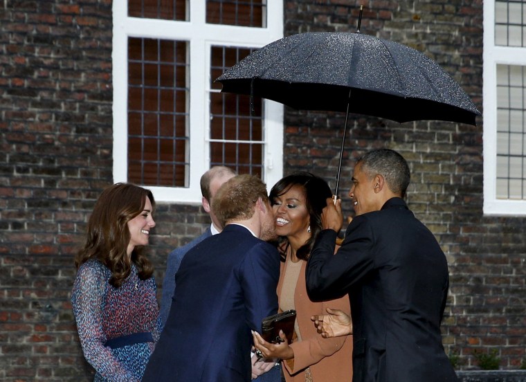 U.S. President Barack Obama and first lady Michelle Obama are greeted by Prince William, his wife Catherine, Duchess of Cambridge, and Prince Harry, upon arrival for dinner at Kensington Palace in London, Britain