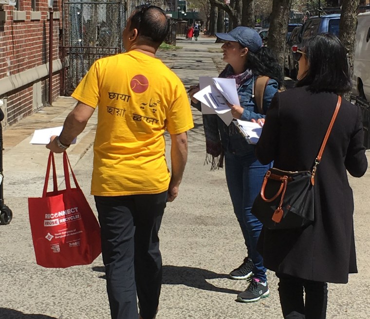 Rasel Rahman (left), Paola Di Lorenzo, and Yangchen Chadotsang search for their next building to knock on doors.