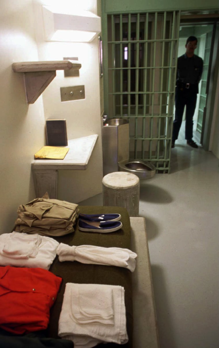 Image: A federal corrections officer stands in the doorway of a typical cell at a maximum security facility in Florence, Colo.,