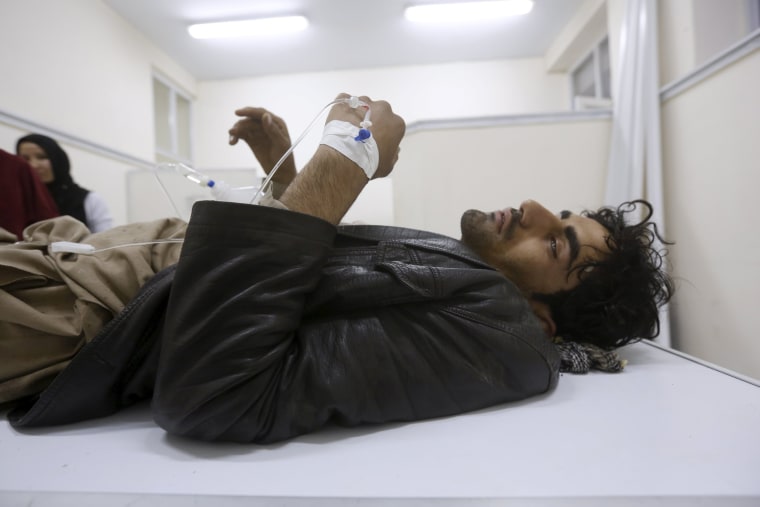 Image: An Afghan man receives treatment at a hospital after a suicide car bomb attack in Kabul