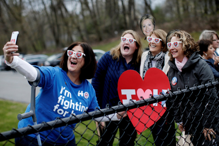 Image: Supporters of Democratic U.S. presidential candidate Hillary Clinton pose for a selfie photograph outside the Grafflin School where Clinton voted in the New York U.S. presidential primary election in Chappaqua