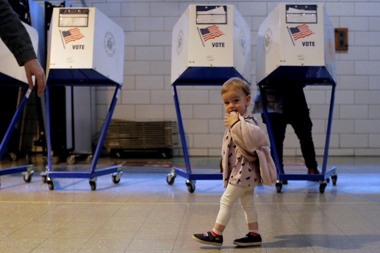 Image: People vote in the New York primary elections at a polling station in the Brooklyn borough of New York