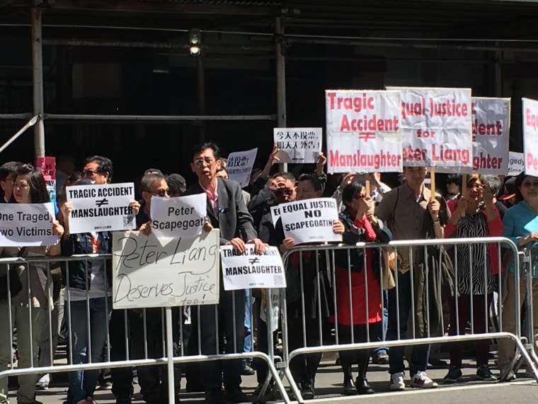 Image: Protesters support Officer Peter Liang outside a Brooklyn courthouse before his sentencing for manslaughter in the killing of Akai Gurley, in New York