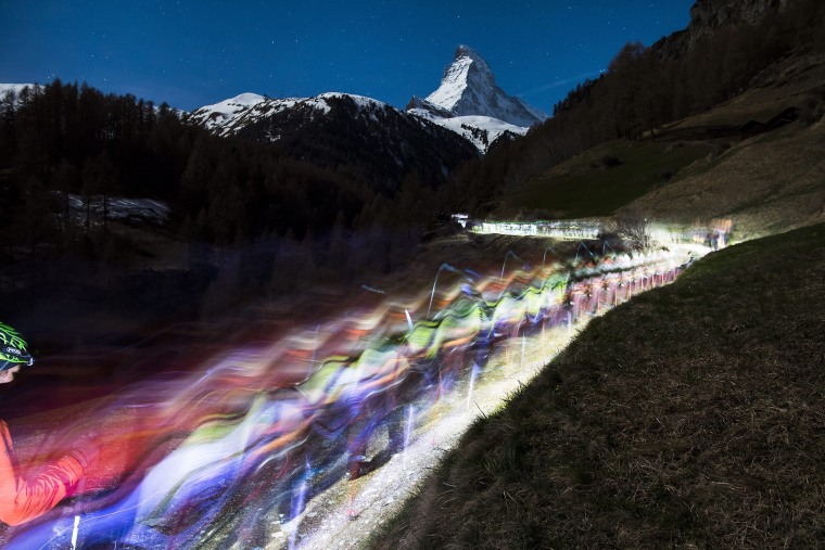 Image: Competitors climb in front of the Matterhorn as they start the 20th edition of the Glacier Patrol race