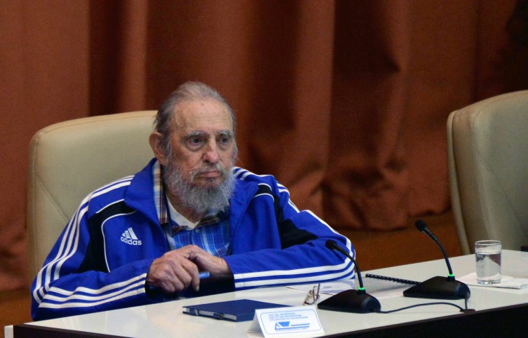 Cuban Former President Fidel Castro applauding during the closing ceremony of VII Congress of Cuban Communist Party