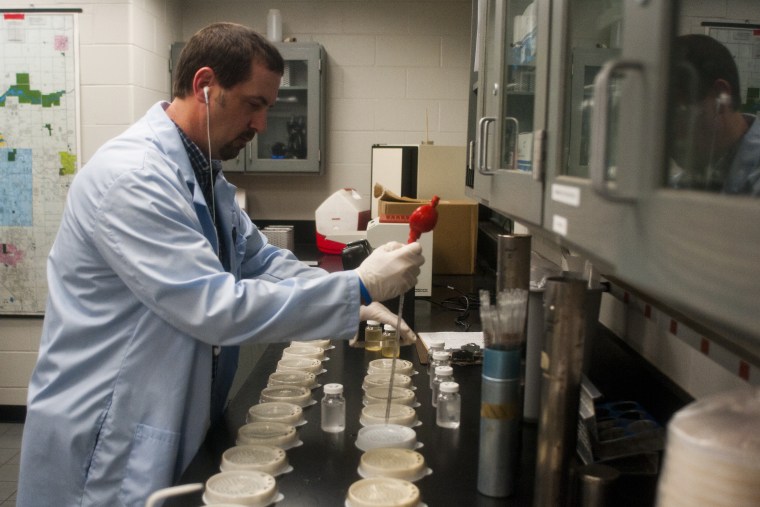 In this 2013 file photo, Michael Glasgow, laboratory water quality supervisor, tests water for bacteria and pH levels, among other tests at the Flint water plant.