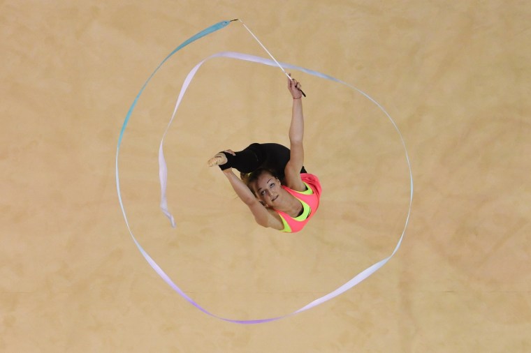 Image: A gymnast takes part in an open training session for the rhythmic gymnast