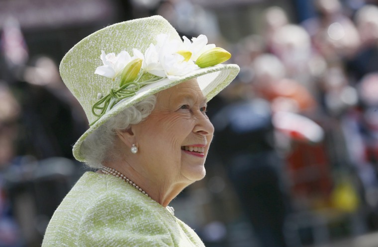 Image: Britain's Queen Elizabeth smiles as she greets well wishers on her 90th birthday during a walkabout in Windsor, west of London