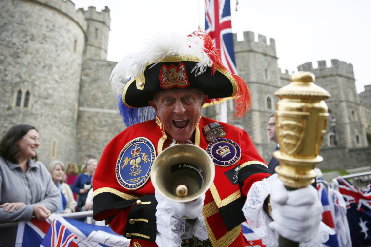 Image: A Royal fan dressed as a Town Crier gathers to celebrate Queen Elizabeth's 90th birthday in Windsor,