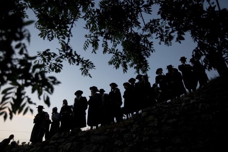 Image: Ultra-Orthodox Jewish men gather to collect water from a spring to make matza