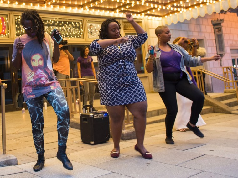 Image: People dance during a vigil in Washington, D.C.