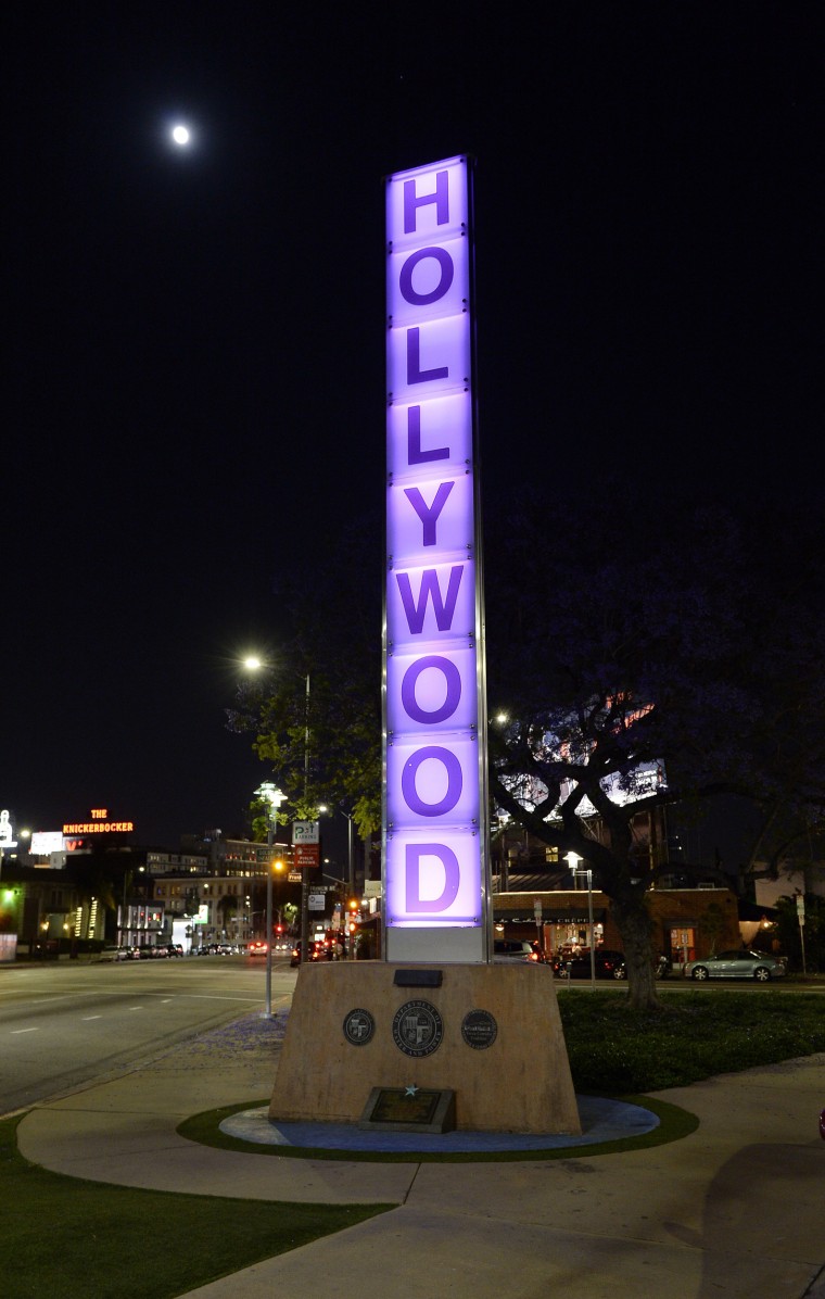 Image: A sign is illuminated in purple in memory of the late musician in Los Angeles, California