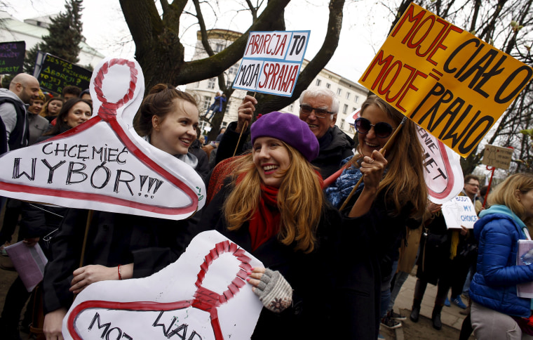 Image: People demonstrate against plans of tightening the abortion law in Warsaw
