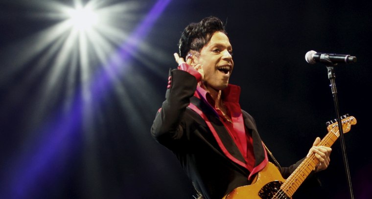 Image: U.S. musician Prince performs on stage at Yas Arena in Yas Island