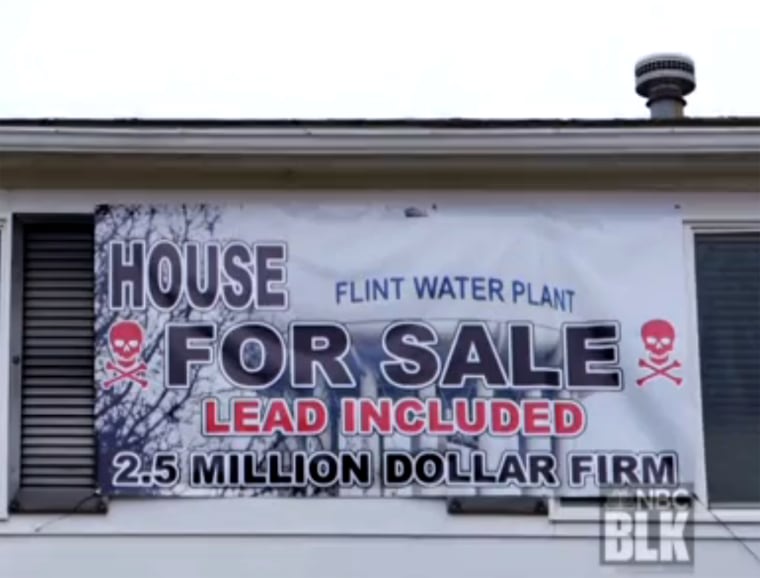 In March, Estelle Holley bought a mock "for sale" sign decorated with a skull and bones and draped it across the front of her house.