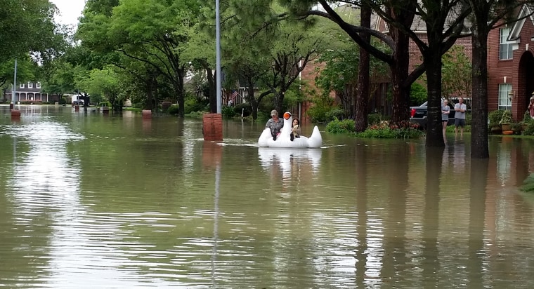 Midwife rides inflatable swan through Houston floods to deliver baby