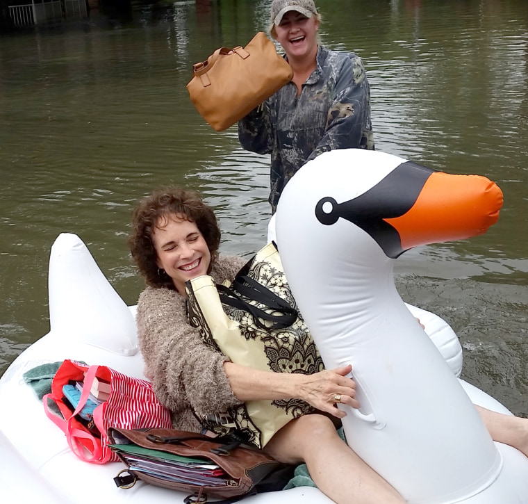 Midwife rides inflatable swan through Houston floods to deliver baby