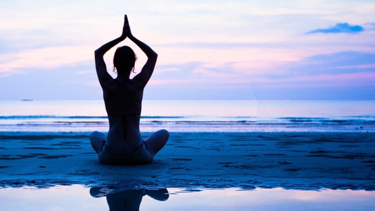 meditating on the beach