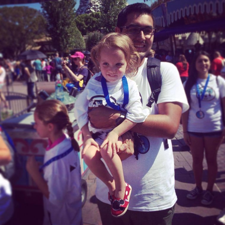 Anderson's daughter, Jazmine, in Disneyland with Danny from Together We Rise