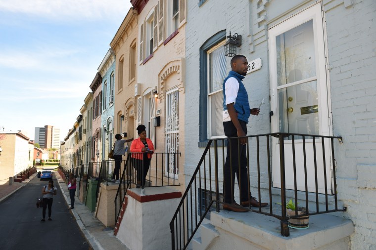 Baltimore mayoral candidate DeRay Mckesson knocks on doors to meet potential voters on Wednesday, April 20, 2016.