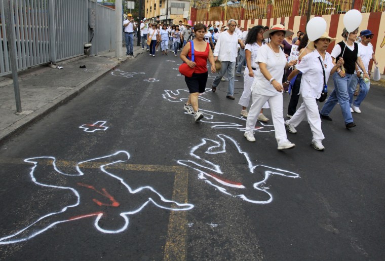People participate in a march in Curenavaca against Mexican President Felipe Calderon's war on drug cartels