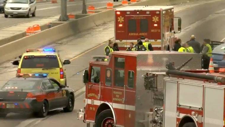 Image: woman driving on Milwaukee freeway shot