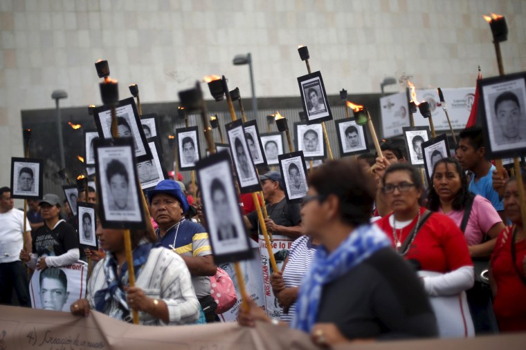 Protesters criticize government's handling of the investigation in the case of 43 students, in Mexico City.
