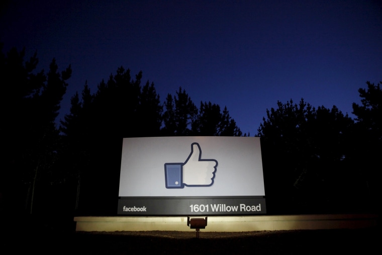 Image: The sun rises behind the entrance sign to Facebook headquarters in Menlo Park before the company's IPO launch,