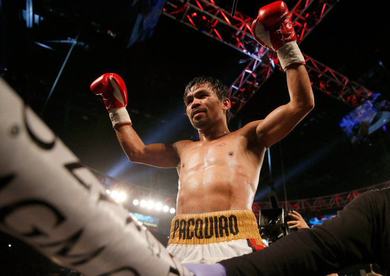 Image: Manny Pacquiao celebrates after winning in Las Vegas, Nevada