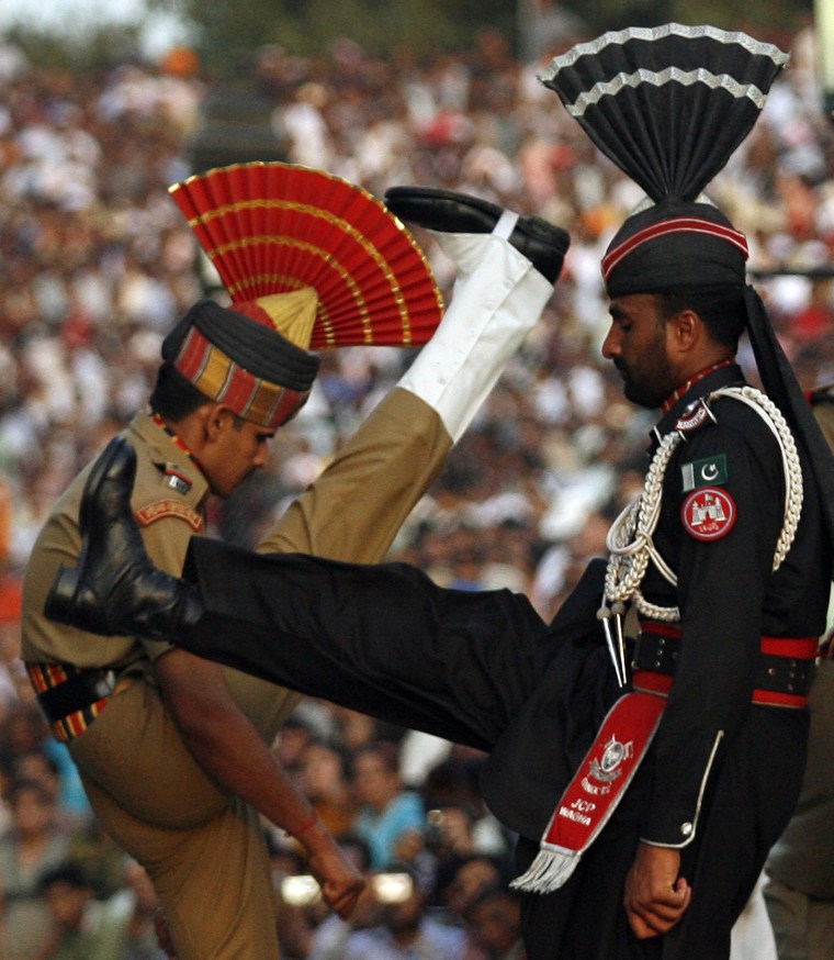 Image: Pakistani Ranger and Indian BSF officer goose-step at Wagah border
