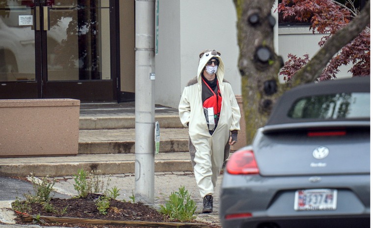 Image: A man claiming to be in possession of a bomb exits the Fox45 television station which was evacuated due to a bomb threat in Baltimore