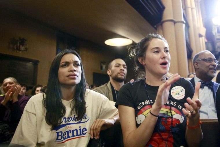 Image: Actresses Rosario Dawson (L) and Shailene Woodley (R) listen to U.S. Democratic presidential candidate Bernie Sanders speak during a discussion at the First Unitarian Congregational Society in the Brooklyn borough of New York