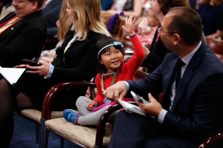 Image: Wong mimics her father during Ryan's weekly news conference on Take Our Daughters and Sons to Work Day at the U.S. Capitol in Washington