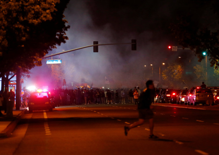 Image: Demonstrators gather outside Republican U.S. presidential candidate Donald Trump's campaign rally in Costa Mesa