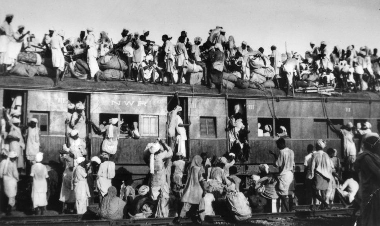 Muslim refugees sit on the roof of an overcrowded train near New Delhi as they try to flee India on Sept. 19, 1947. In the partition of the subcontinent into India and Pakistan after gaining independence from Britain in 1947, an estimated 1 million Hindus, Muslims and Sikhs were killed in rioting, and 12 million were uprooted from their homes.