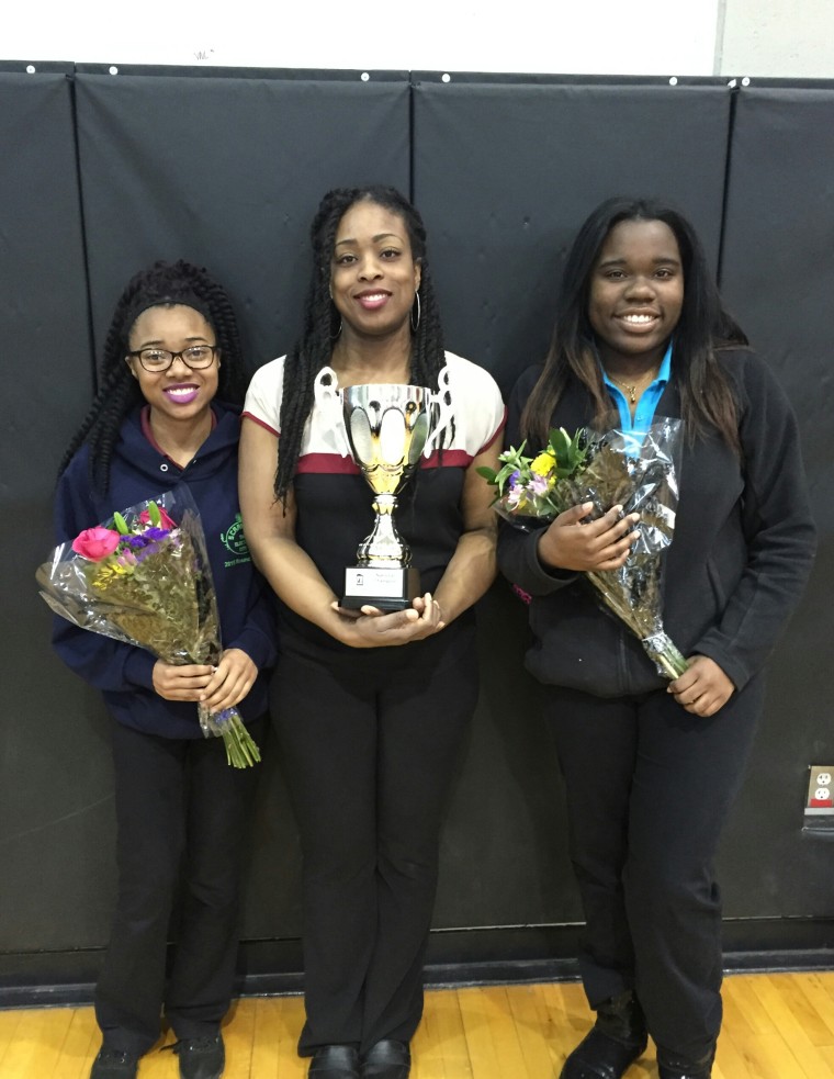 17-year-old Tamara Morrison (left), University Prep High School coach Sharon Hopkins, and 18-year-old Tiera Colvin (right).