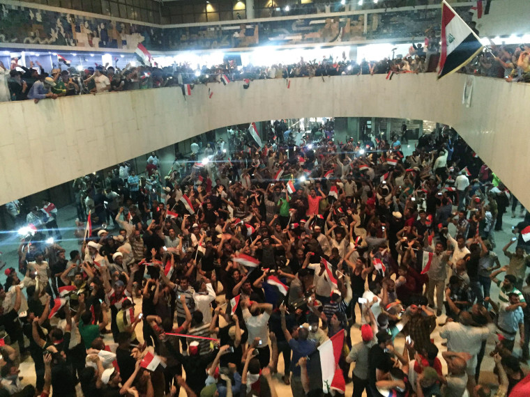 Image: Followers of Iraq's Shi'ite cleric Moqtada al-Sadr are seen in the parliament building as they storm Baghdad's Green Zone in Iraq