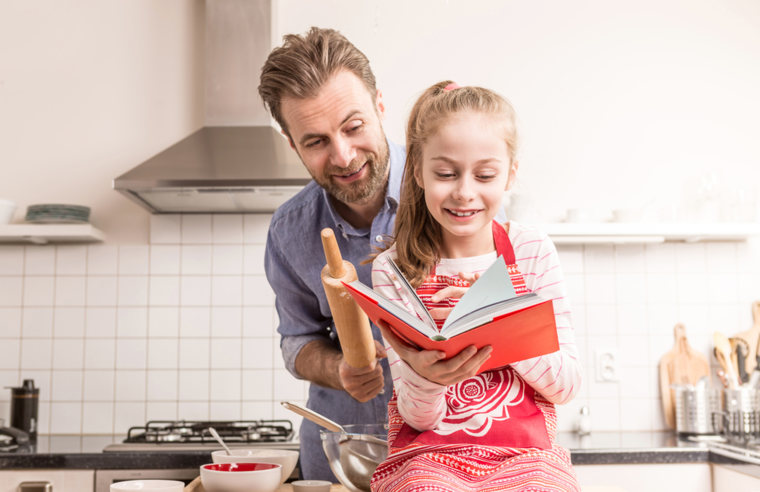 Father and daughter cooking