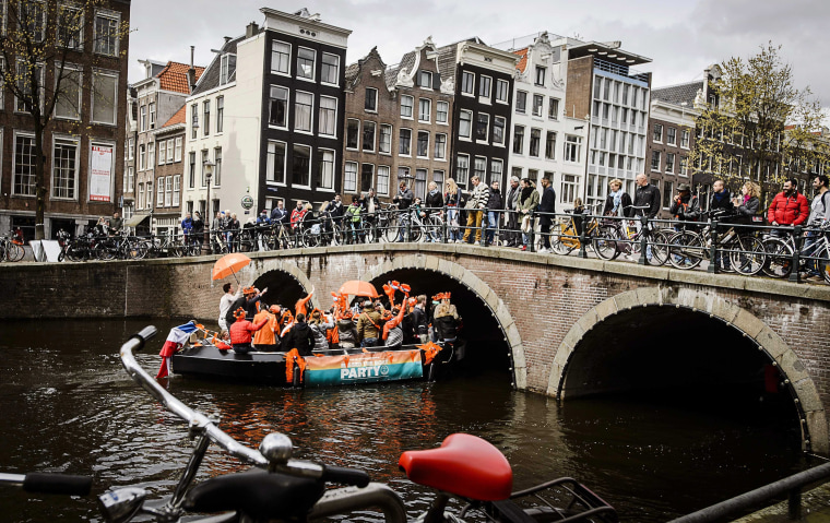 Image: Tourists in Amsterdam on April 30