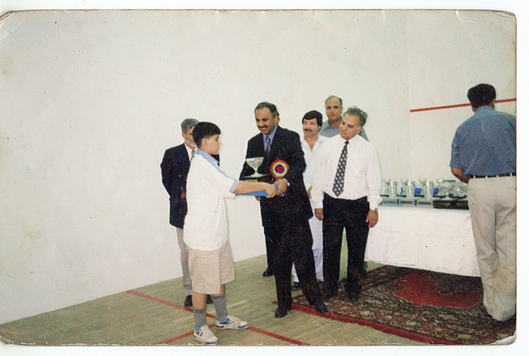 Maria Toorpakai winning her first squash trophy in the under 12 division at the Hashim Khan Junior Squash Championship.