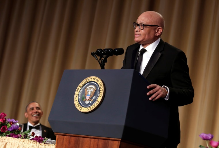 Image: President Barack Obama listens to comedian Larry Wilmore at the White House Correspondents' Association annual dinner