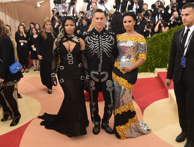 Image: Nicki Minaj, Jeremy Scott and Demi Lovato make an entrance at the gala