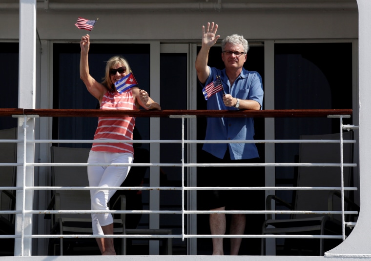 Image: Passengers from U.S. Carnival cruise ship Adonia wave during their arrival at Havana Port