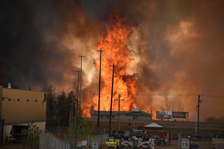 Image: Flames rise in Industrial area south Fort McMurray Alberta Canada