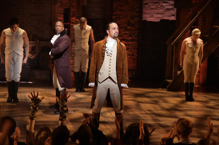 Actor Leslie Odom, Jr. (L)  and actor, composer Lin-Manuel Miranda (R) and cast of "Hamilton" perform on stage.