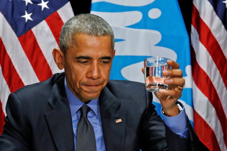 Image: U.S. President Barack Obama drinks a glass of filtered water from Flint, a city struggling with the effects of lead-poisoned drinking water, during a meeting will local and federal authorities in Michigan