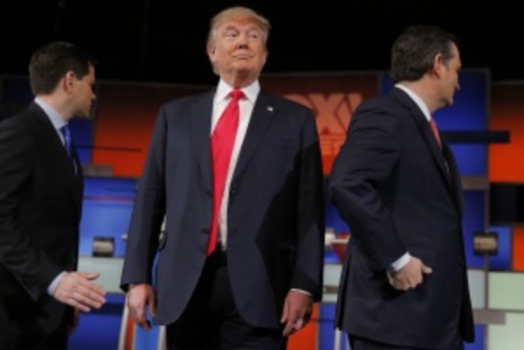 Republican U.S. presidential candidate Trump stands between rivals Rubio and Cruz before the start of the Fox Business Network Republican presidential candidates debate in North Charleston